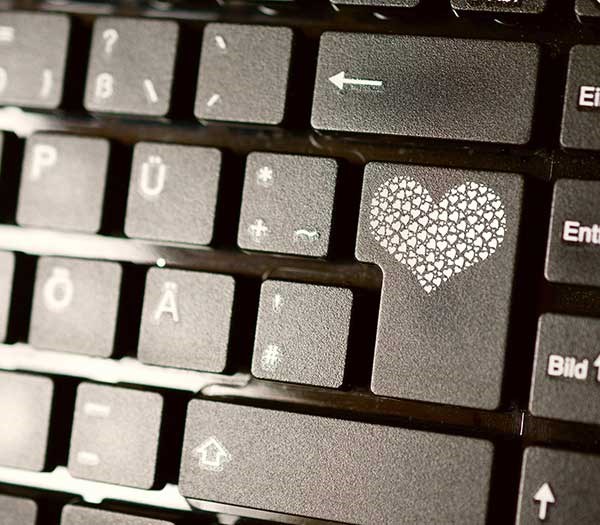 Keyboard with a heart on the return key.