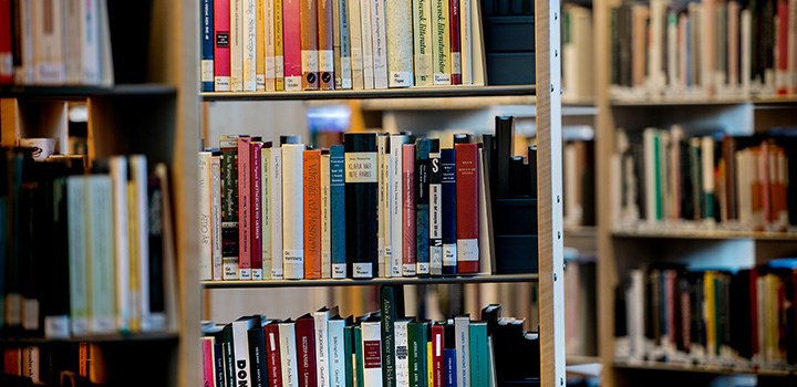 Photo of bookshelves filled with books.