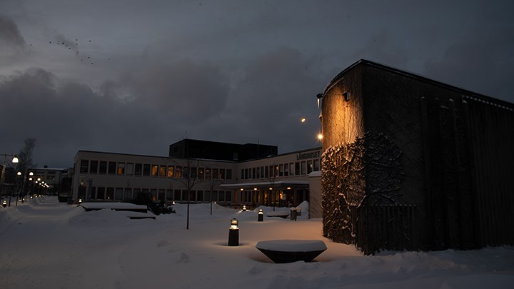 One section of Långhuset, photographed on a cold winter evening with snow on the ground.