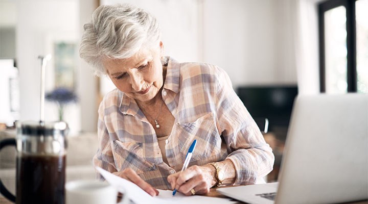 Senior woman writing