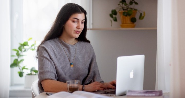 student chatting in front of computer