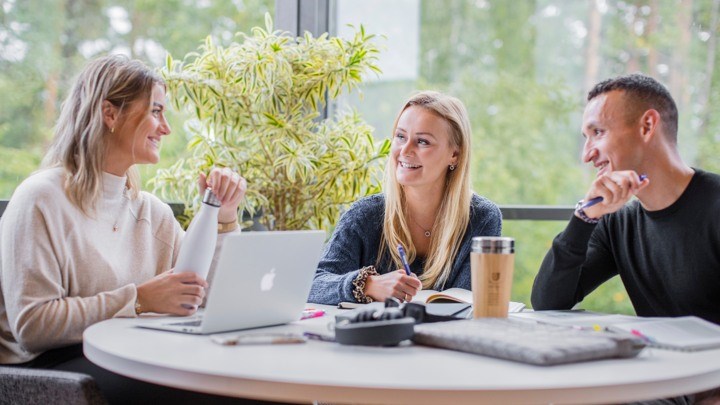 Two students with a laptop.