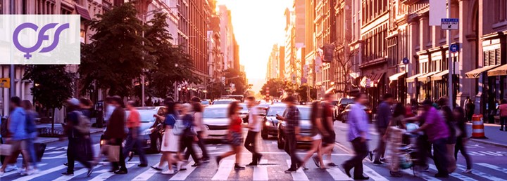 People are crossing a pedestrian crossing.